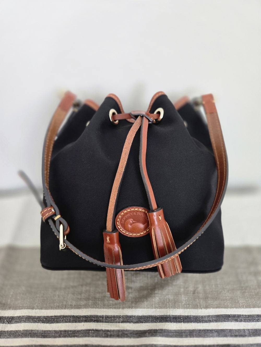 Dooney & Bourke Black Nylon Bucket Bag with Brown Trim and Tassels - Picture 3 of 16